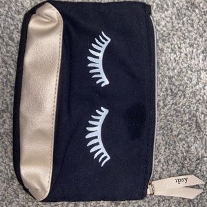 Black and gold Ipsy make up bag